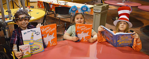 Children reading Dr. Seuss books including Horton Hears a Who